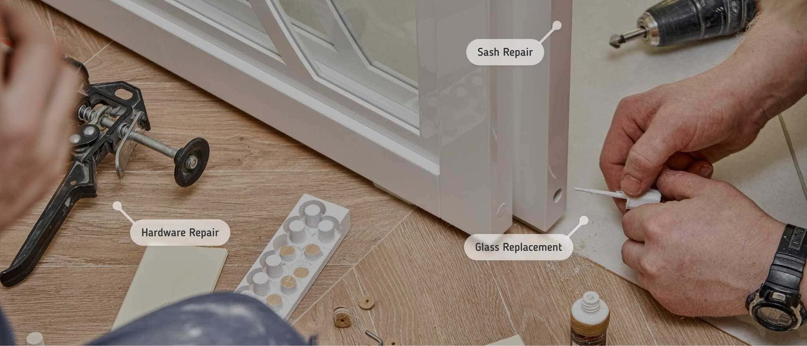 Close-up of a window repair process, showing a worker fixing a white-framed window on a wooden floor. Labeled areas highlight hardware repair, sash repair, and glass replacement. Tools, screws, and repair materials are scattered around, with a drill and adhesive being used for precise adjustments.